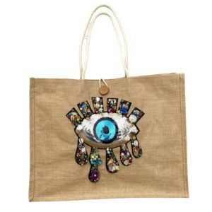 Bolsa de yute con parche de ojo bordada a mano con dijes